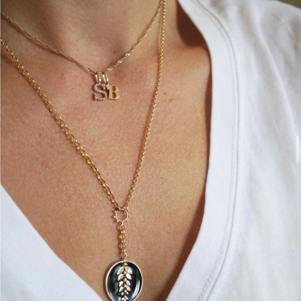 Bayou with love 14k gold and diamond initial charm.